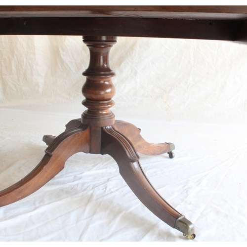 656 - Early 19th century mahogany tilt top breakfast table, the rectangular top with rounded corners raise... 