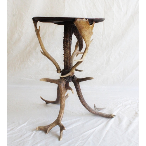 661 - Natural History interest, a rustic occasional table, the circular oak top raised on stag horn base, ... 