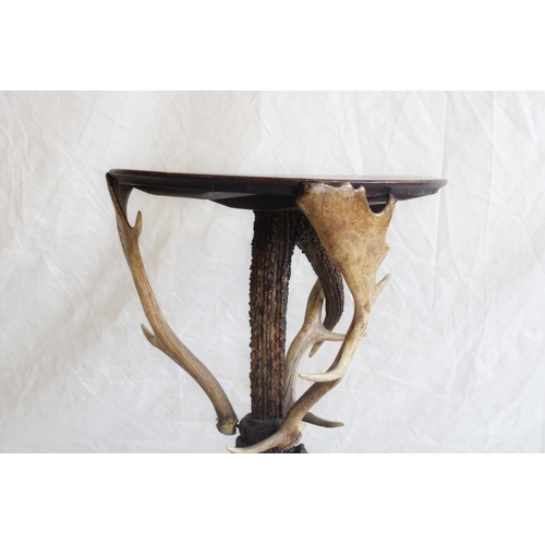 661 - Natural History interest, a rustic occasional table, the circular oak top raised on stag horn base, ... 