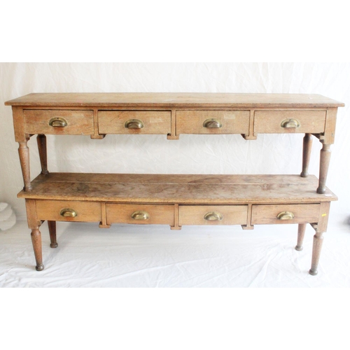 664 - Pair of Arts & Crafts style oak low benches, the rectangular top above four frieze drawers, rais... 