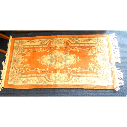 446 - Orange and cream Chinese style rug.