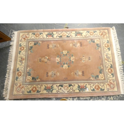 458 - Chinese pink and cream rug.