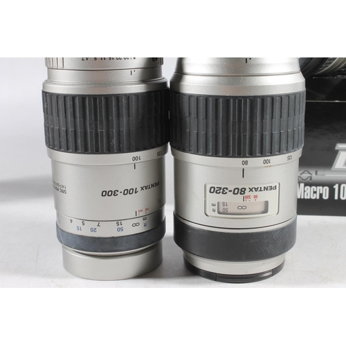 1143 - Group of ten Pentax camera lenses to include:SMC DFA Macro WR 2.8 100mm 49mm lens boxed; SMC FAJ1:4(... 