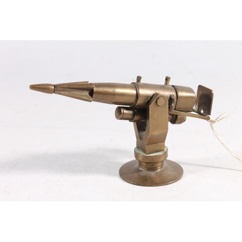 1447 - Brass desktop paperweight model of a Whalers harpoon gun, 14cm long.