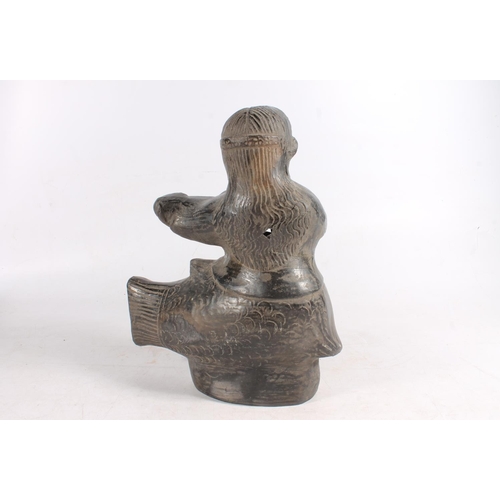 463 - South American pre Columbian blackware pottery vessel in the form of a mermaid playing lute, restore... 