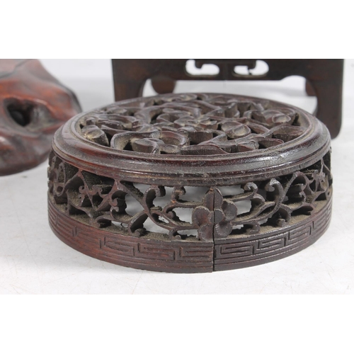 610 - 19th century Chinese hardwood jar cover, carved and pierced with cherry blossom, a square wooden sta... 