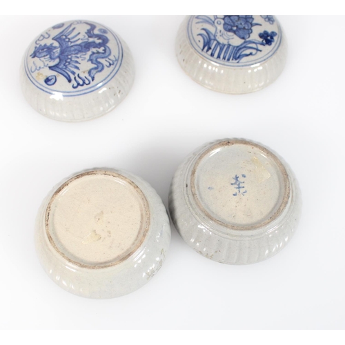 546 - Pair of domed boxes and covers, possibly Korean, with phoenix and duck decoration, the edges ribbed,... 