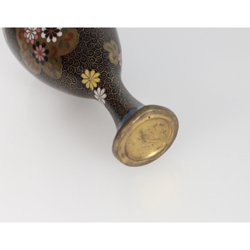 551 - Small cloisonne vase of tapering egg form, supported on an elongated spreading foot, the black ename... 