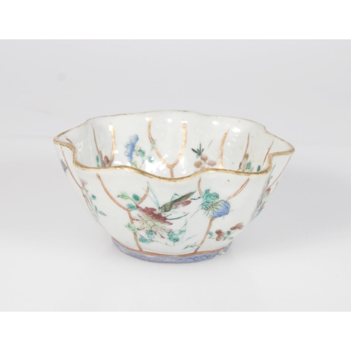 566 - 19th century Chinese famille rose lobed bowl with floral and insect decoration, two incised marks to... 