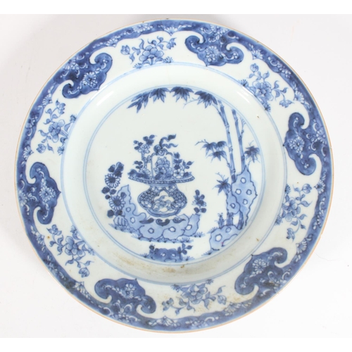 568 - 18th century Chinese blue and white plate with flower basket decoration, 22cm and three other plates... 