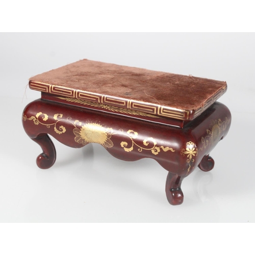 585 - 19th century Chinese brown and gilt lacquered stand with deep apron and supported on scroll feet, 18... 