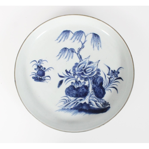 591 - 18th century Chinese low blue and white dish decorated with lotus, willow, and other flowering plant... 