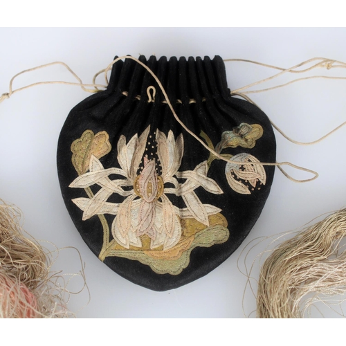 596 - Finely embroidered 19th century Chinese purse, the black silk beautifully stitched with a lotus flow... 