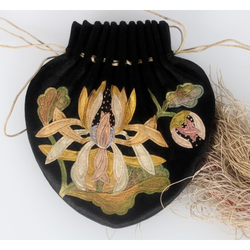 596 - Finely embroidered 19th century Chinese purse, the black silk beautifully stitched with a lotus flow... 