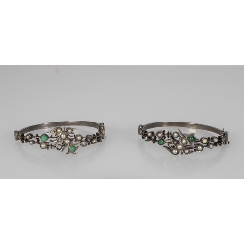 600 - Pair of Chinese hinged silver bracelets decorated with pearls and jade, with a bird to the centre of... 