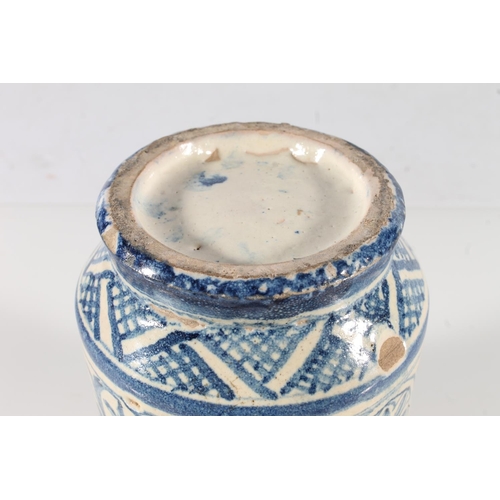 478 - Antique blue and white earthenware albarello, with two lion mask handles, 14.5cm.