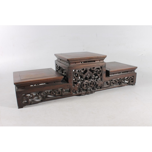 481 - Chinese carved hardwood garniture stand, 50cm long.