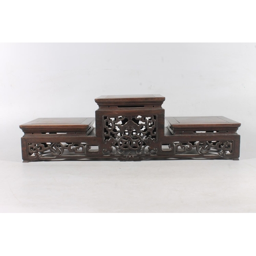 481 - Chinese carved hardwood garniture stand, 50cm long.