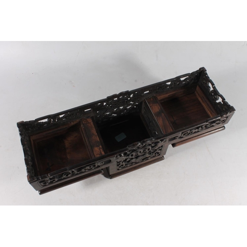 481 - Chinese carved hardwood garniture stand, 50cm long.