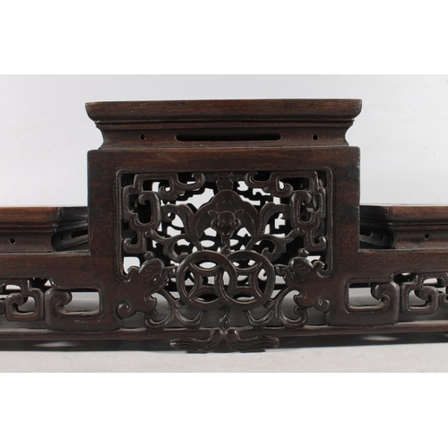 481 - Chinese carved hardwood garniture stand, 50cm long.