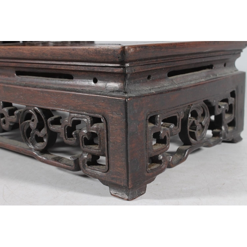 481 - Chinese carved hardwood garniture stand, 50cm long.