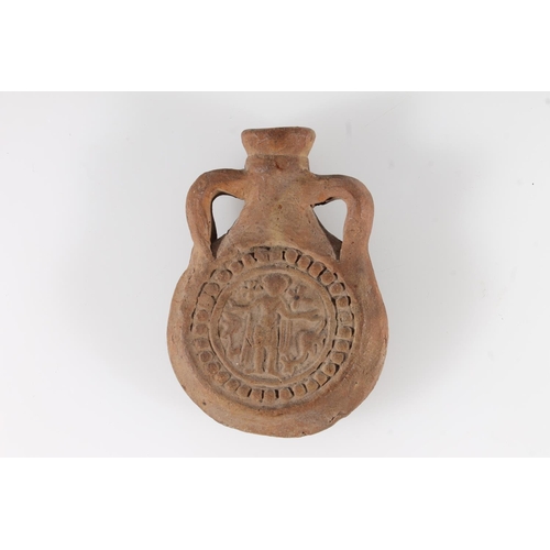 487 - Byzantine Coptic terracotta moulded ampulla with depiction of a saint, 9.5cm tall.