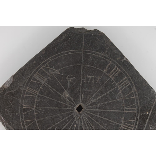 491 - Georgian slate sun dial, incised with makers initials 'IG' and dated 1717, 12.5cm wide.