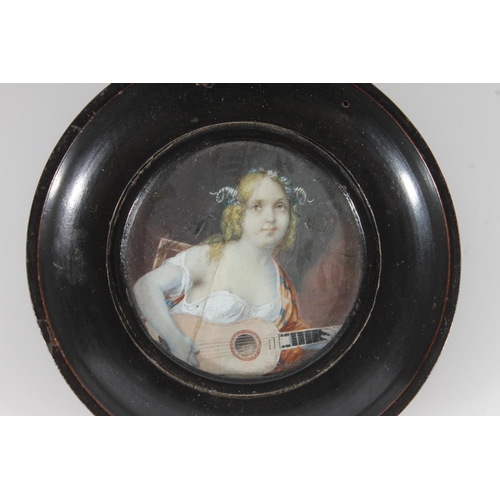 498 - Three ivory portrait miniatures to include a circular portrait of a young girl with ukulele, frame 1... 