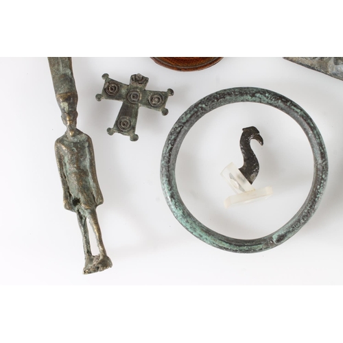 502 - Two metal amulet type Egyptian figures, a metal bangle, a cast metal figure of Christ carrying the c... 