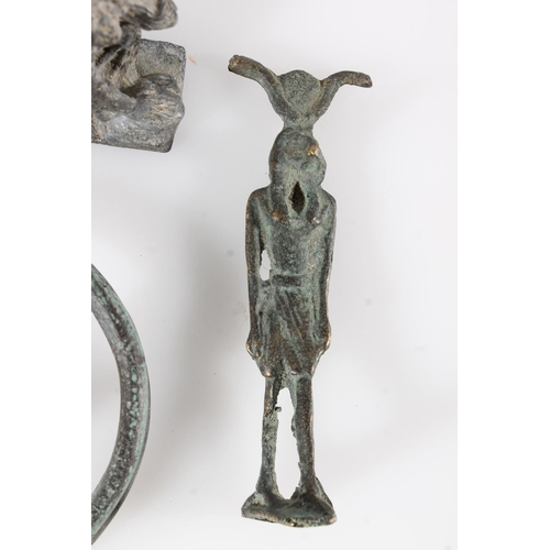 502 - Two metal amulet type Egyptian figures, a metal bangle, a cast metal figure of Christ carrying the c... 