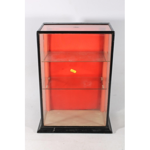 506 - Ebonised wooden glazed table top display case with two glass shelves, 46cm x 30cm x 19cm.