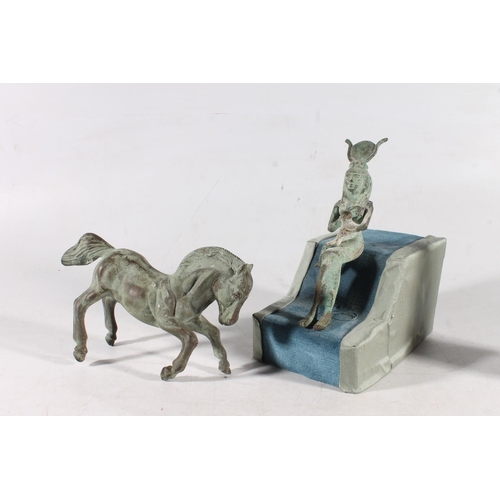 507 - Egyptian metal model of Isis seated with Horus, 16cm tall, a metal model of a horse, model of Sphinx... 