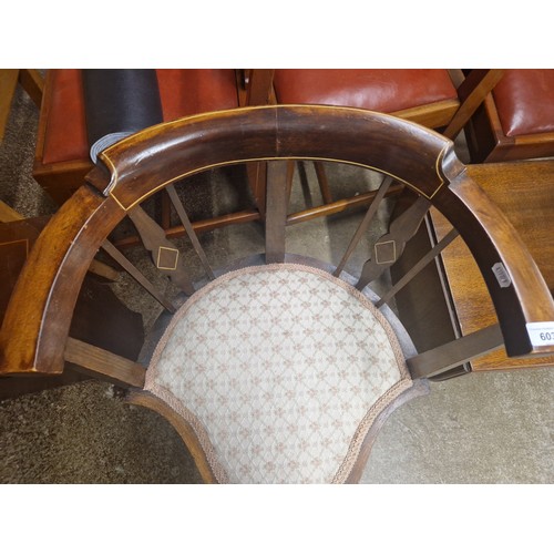 603 - Mahogany inlaid tub chair in floral upholstery 