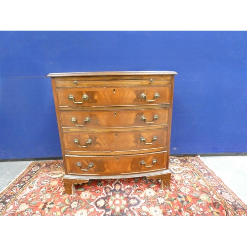 410 - Reproduction mahogany bow fronted four drawer chest of drawers with brushing slide, in the Georgian ... 