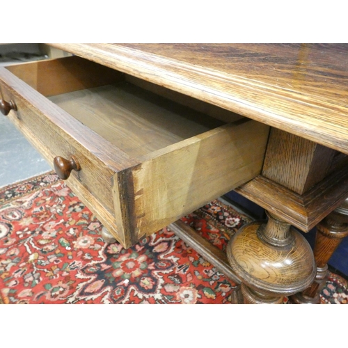 413 - Jacobean revival oak occasional table with three plank top above single drawer and rasied on turned ... 