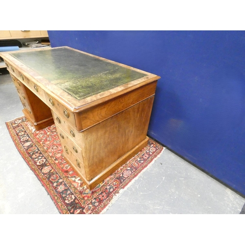 414 - Victorian walnut veneered pedestal desk with tooled leather top, the large drawer with ring handles,... 