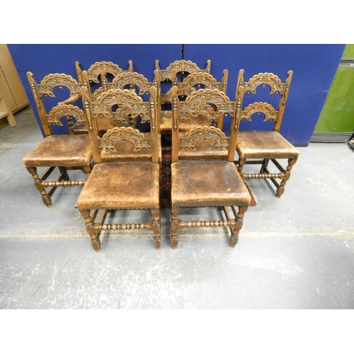 416 - Set of eight Jacobean revival oak dining chairs with arched carved backs, studded leather seats and ... 