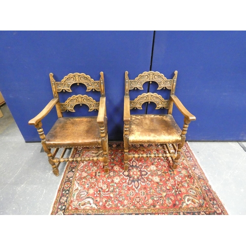 416 - Set of eight Jacobean revival oak dining chairs with arched carved backs, studded leather seats and ... 