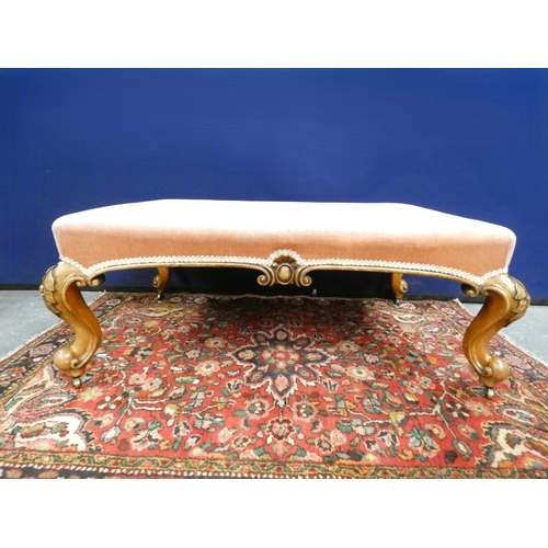 419 - Victorian style walnut large stool upholstered in pink and raised on cabriole supports. Height 40cm.