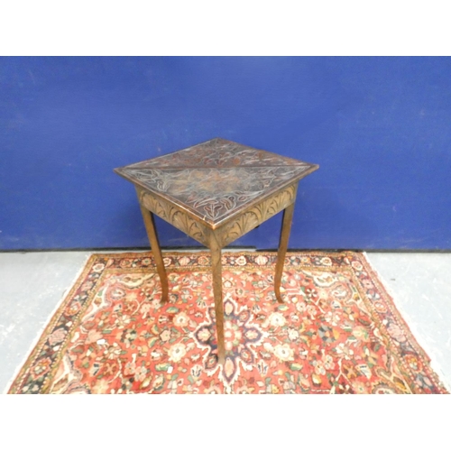 422 - Antique oak envelope table, the top carved with scrolling foliage and embellished with pokerwork des... 