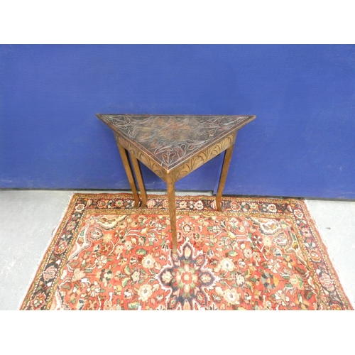 422 - Antique oak envelope table, the top carved with scrolling foliage and embellished with pokerwork des... 