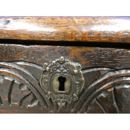 424 - 18th century oak coffer, with four panels with incised diamond motifs and central rosettes, the top ... 