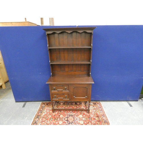 425 - Modern oak dresser on twisted supports, the cupboard base flanked by two drawers. Height 173cm, Widt... 