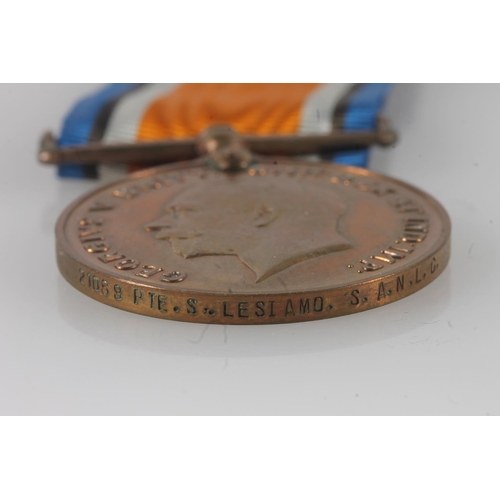 1409 - Medal of 21069 Private Sam Lesiamo of the South African Native Labour Corps comprising a WWI war med... 