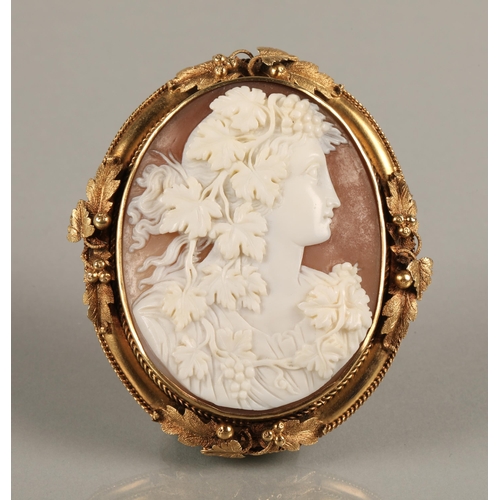 66 - Victorian cameo brooch with the shell carved with a young woman mounted on yellow foliate metal, 7cm... 