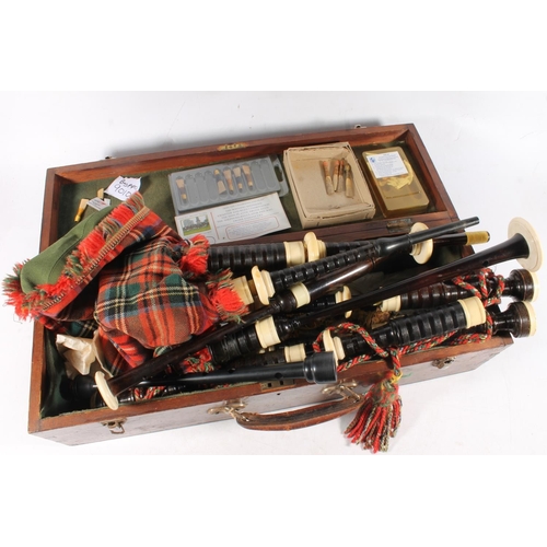 1453 - R G Lawrie of Glasgow, Edinburgh and London, a set of ivory mounted bagpipes and matching practise c... 