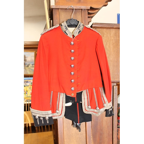 1458 - British army uniform, a red doublet jacket having W Jones & Co of London white metal Kings Own S... 