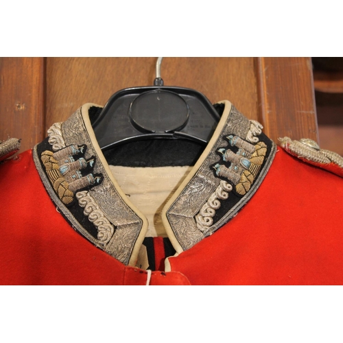 1458 - British army uniform, a red doublet jacket having W Jones & Co of London white metal Kings Own S... 