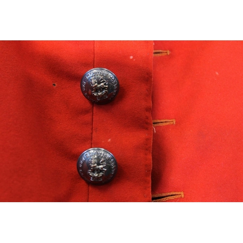 1458 - British army uniform, a red doublet jacket having W Jones & Co of London white metal Kings Own S... 