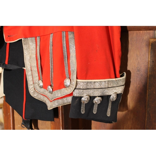 1458 - British army uniform, a red doublet jacket having W Jones & Co of London white metal Kings Own S... 